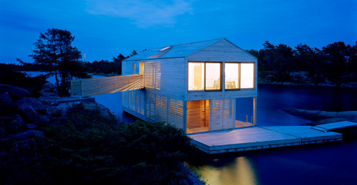 A Floating House That Appears to be Magically Suspended in the Middle of a Lake