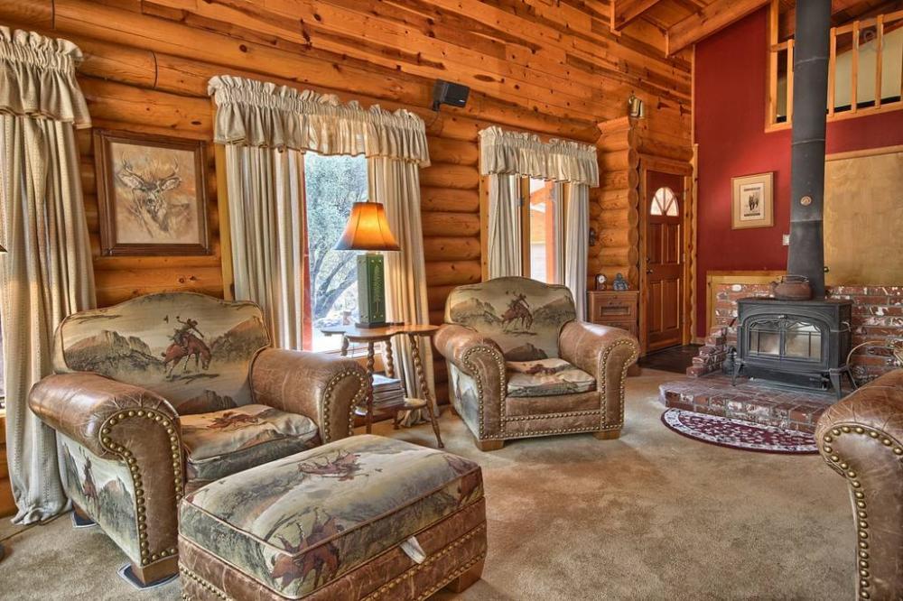 Cozy Looking Woodland Log Home Hides an Astoundingly Beautiful Interior