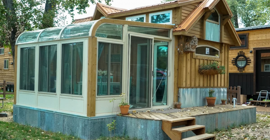 See This Cute, Cozy Tiny Home With a Sunroom