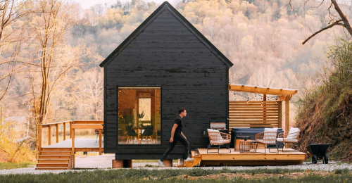 See This Modern Cabin Nestled on 40 Acres with Hot Tub