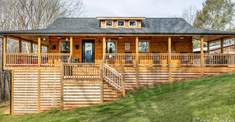 Gorgeous Cabin With a Huge Rocking Chair and Wrap Around Porch